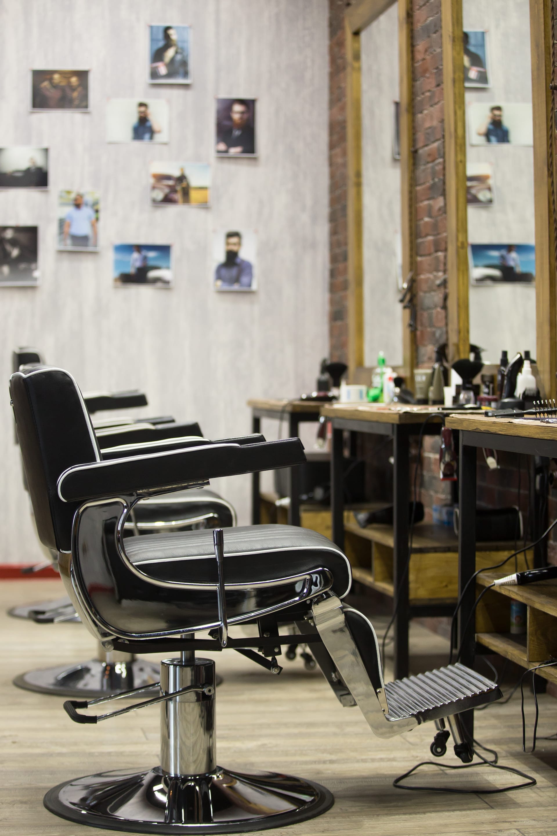 Premium barbershop interior — warm lighting, professional setup